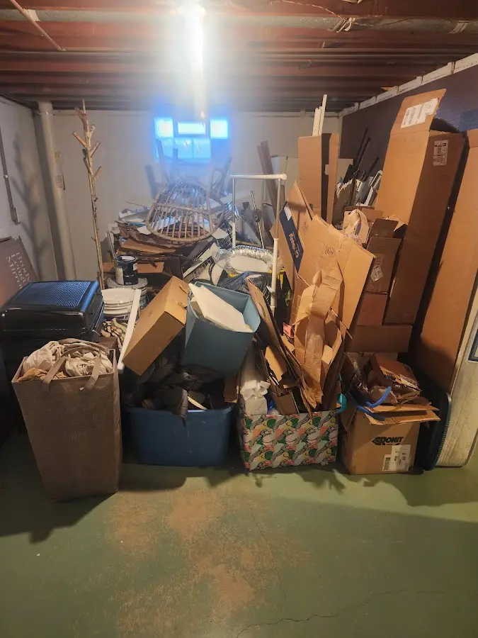 Roll-off dumpster container at job site for 6 Yard Dumpster Rental in Siloam Springs